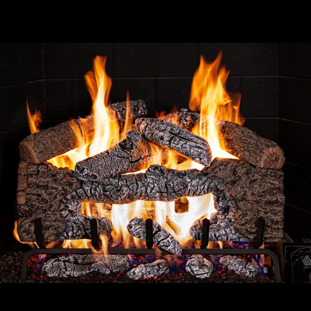 Charred cinder oak vented gas log set with multiple burning logs and bright flames