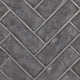 Gray herringbone decorative brick panels with interlocking angled pattern