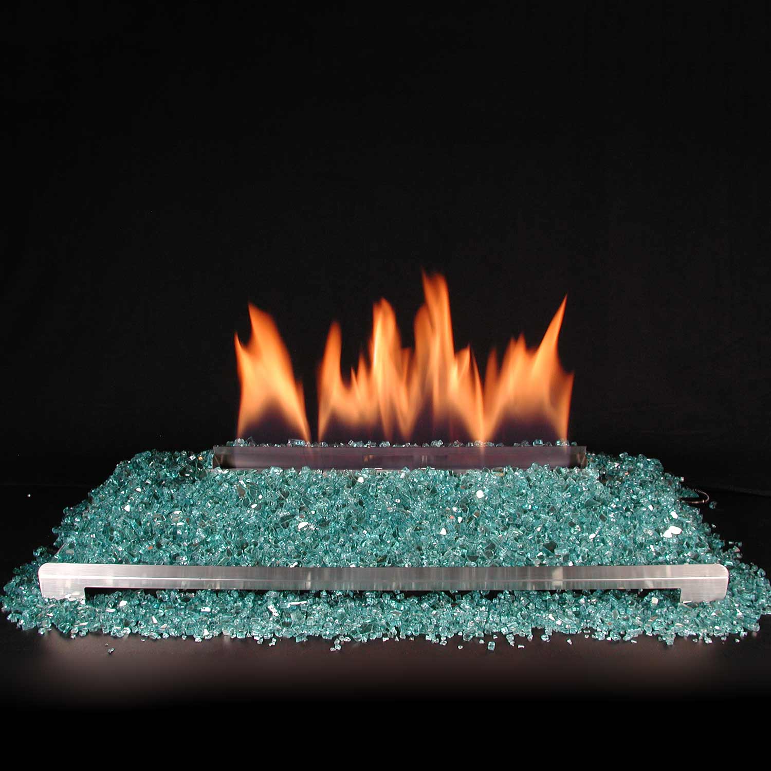Ventless burner kit with flames above teal-blue fire glass media bed