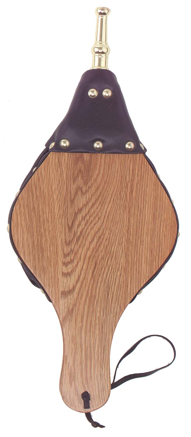 Wood-and-metal bellows with dark purple leather top, brass studs, and a carved wooden body.