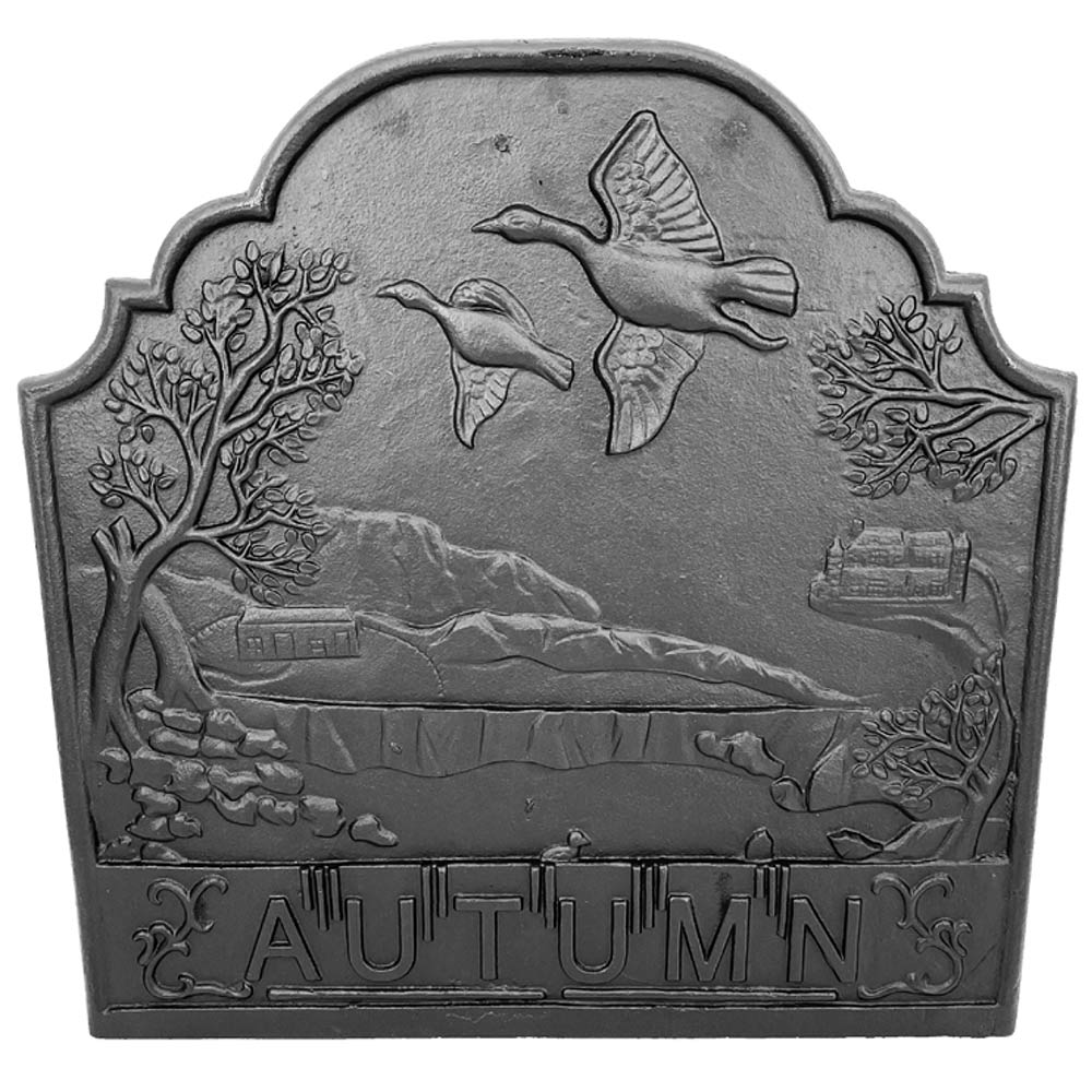 Black cast iron fireback plaque with autumn landscape relief and hummingbird silhouettes