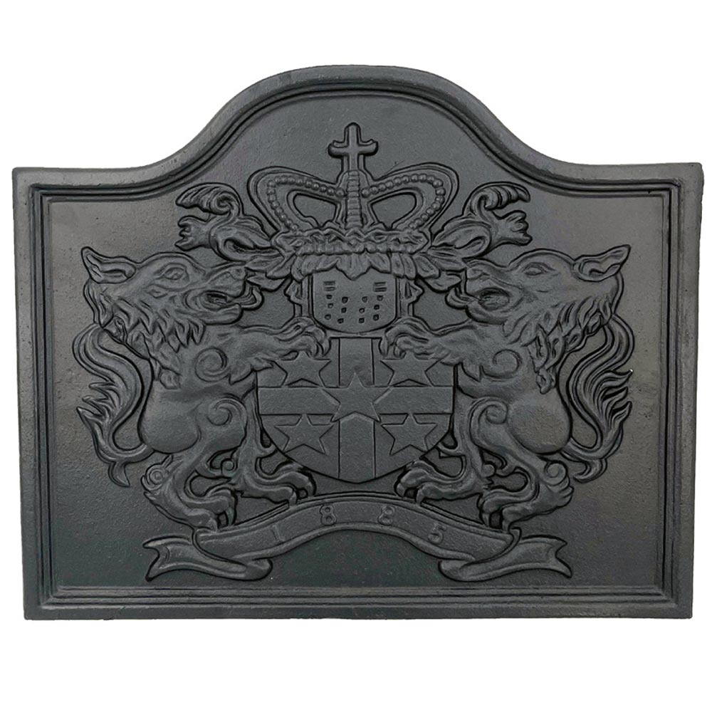 Black cast iron lion fireback with embossed shield and cross, arched top