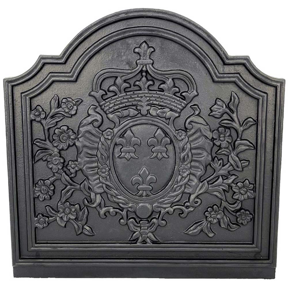 Black cast iron fireback with central crown medallion and floral scrollwork relief