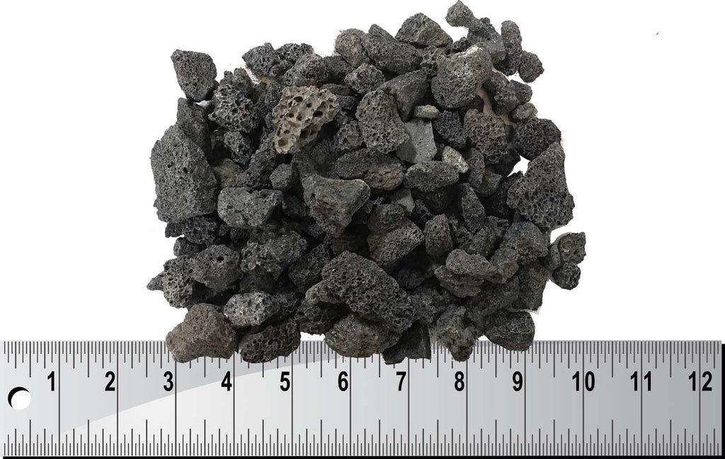 Lava rock stones pile in dark gray and black