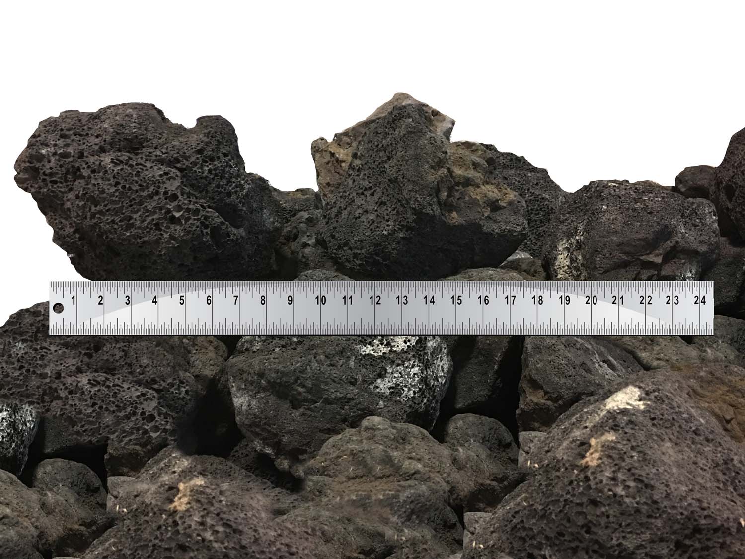 Lava rock boulders, dark black and gray, with size ruler.