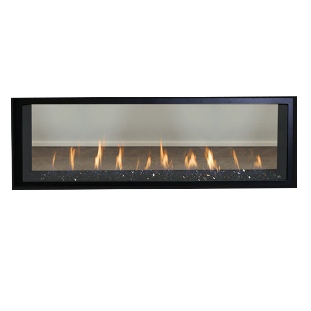 See-through gas fireplace with black frame and lit flames over crushed glass media
