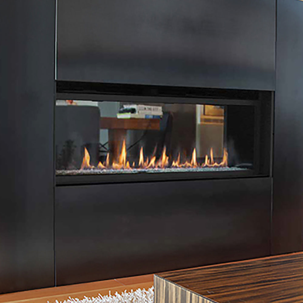 Direct vent gas fireplace with black frame, see-through window, and active flames