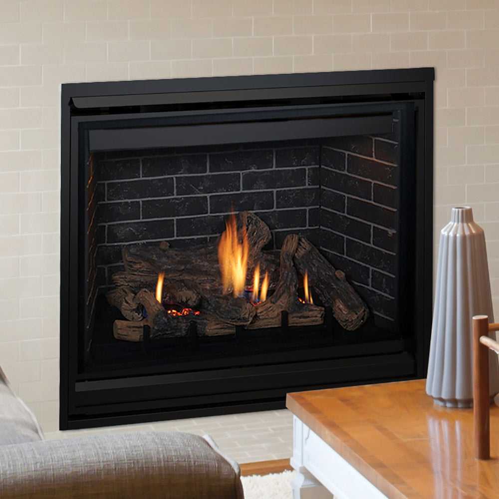 Black direct vent gas fireplace with burning logs and brick-style panel