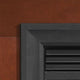 Matte black steel fireplace frame, close-up corner and interior rails