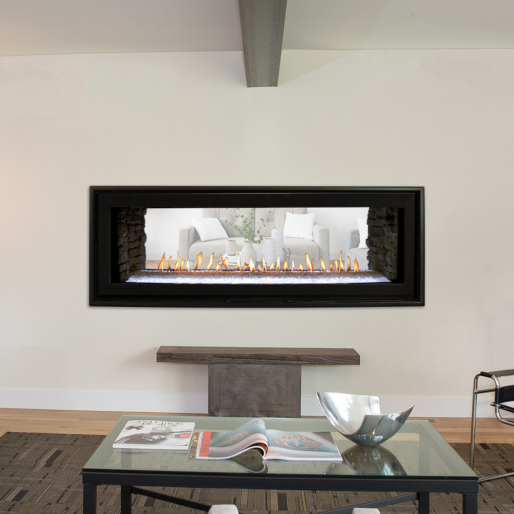 Built-in black linear fireplace with stone surround, flames, and view from living area
