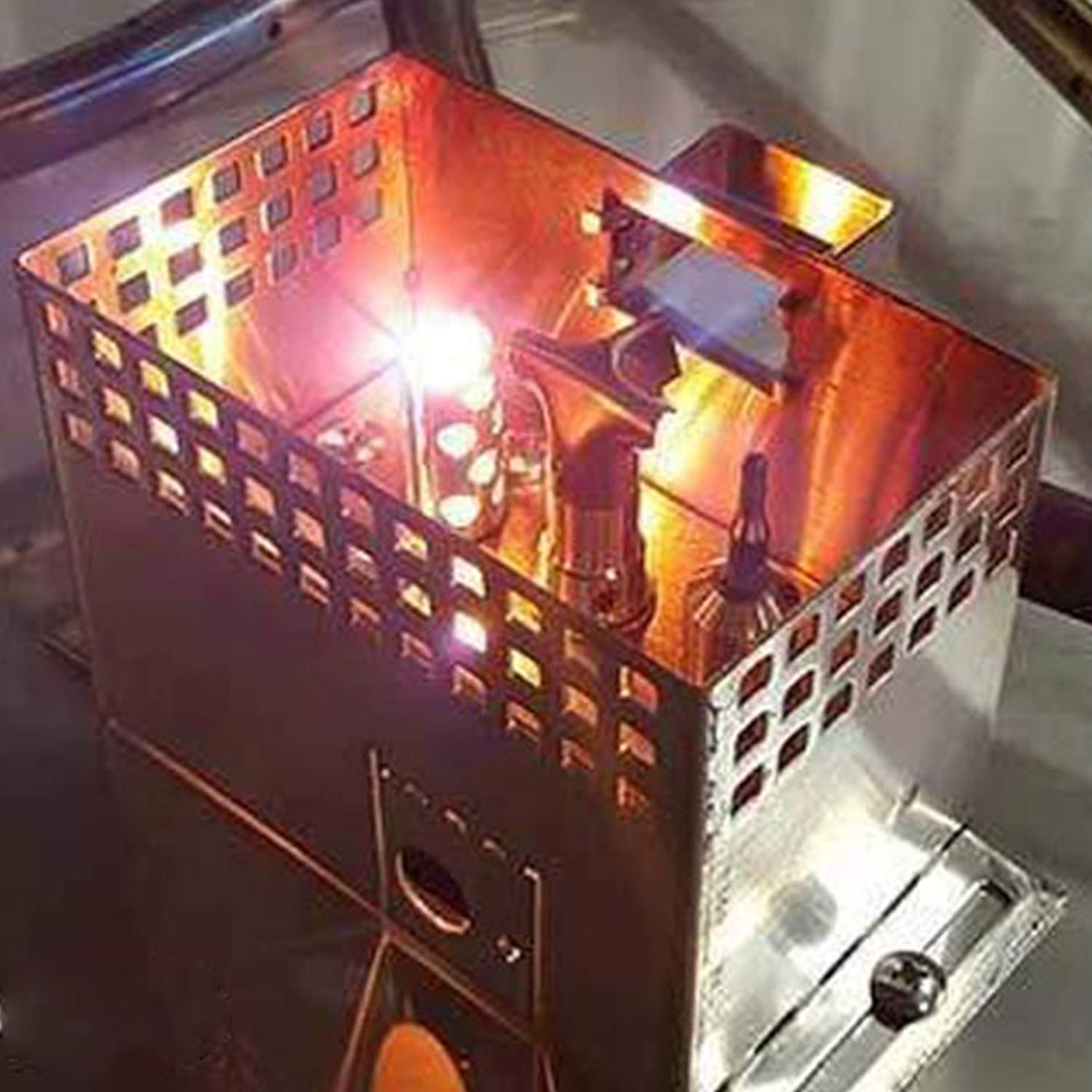 Outdoor gas fireplace burner pan with vivid flame and metal fire box