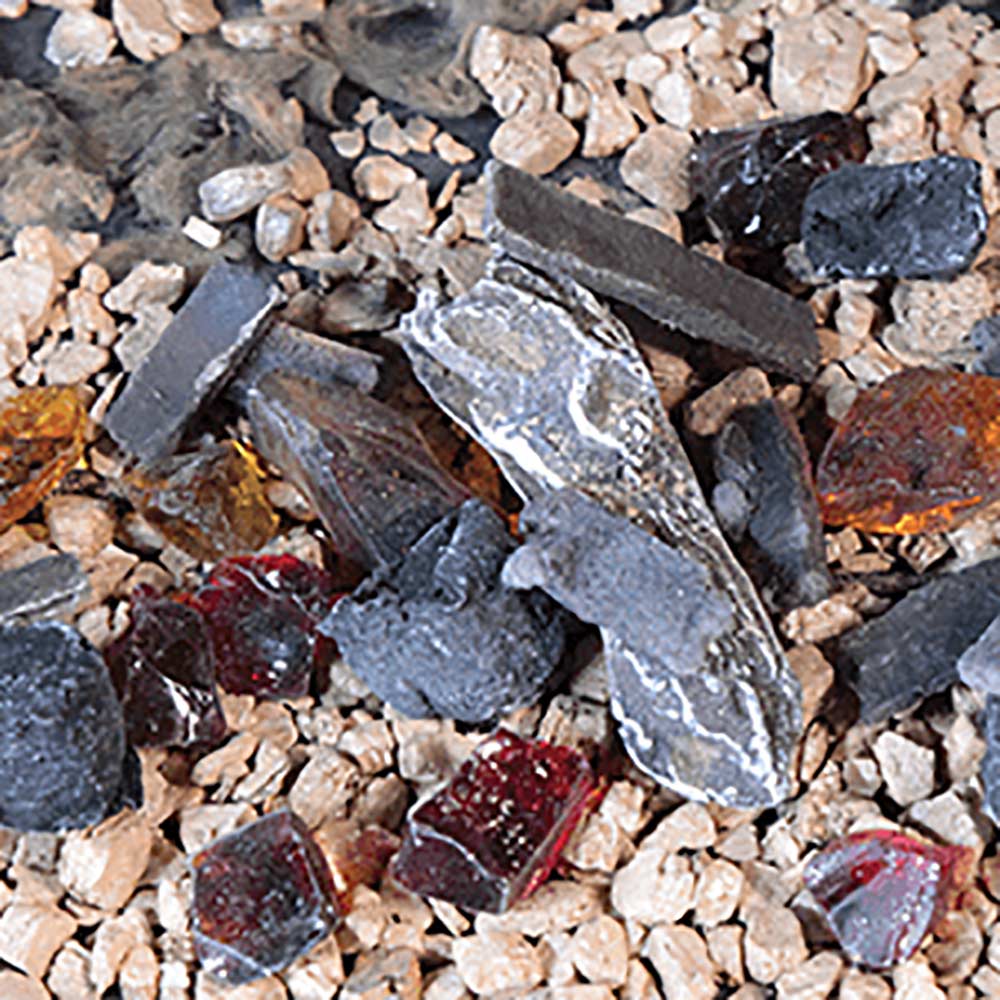 Ember kit with dark charcoal pieces, red embers, and reflective firestarter shards