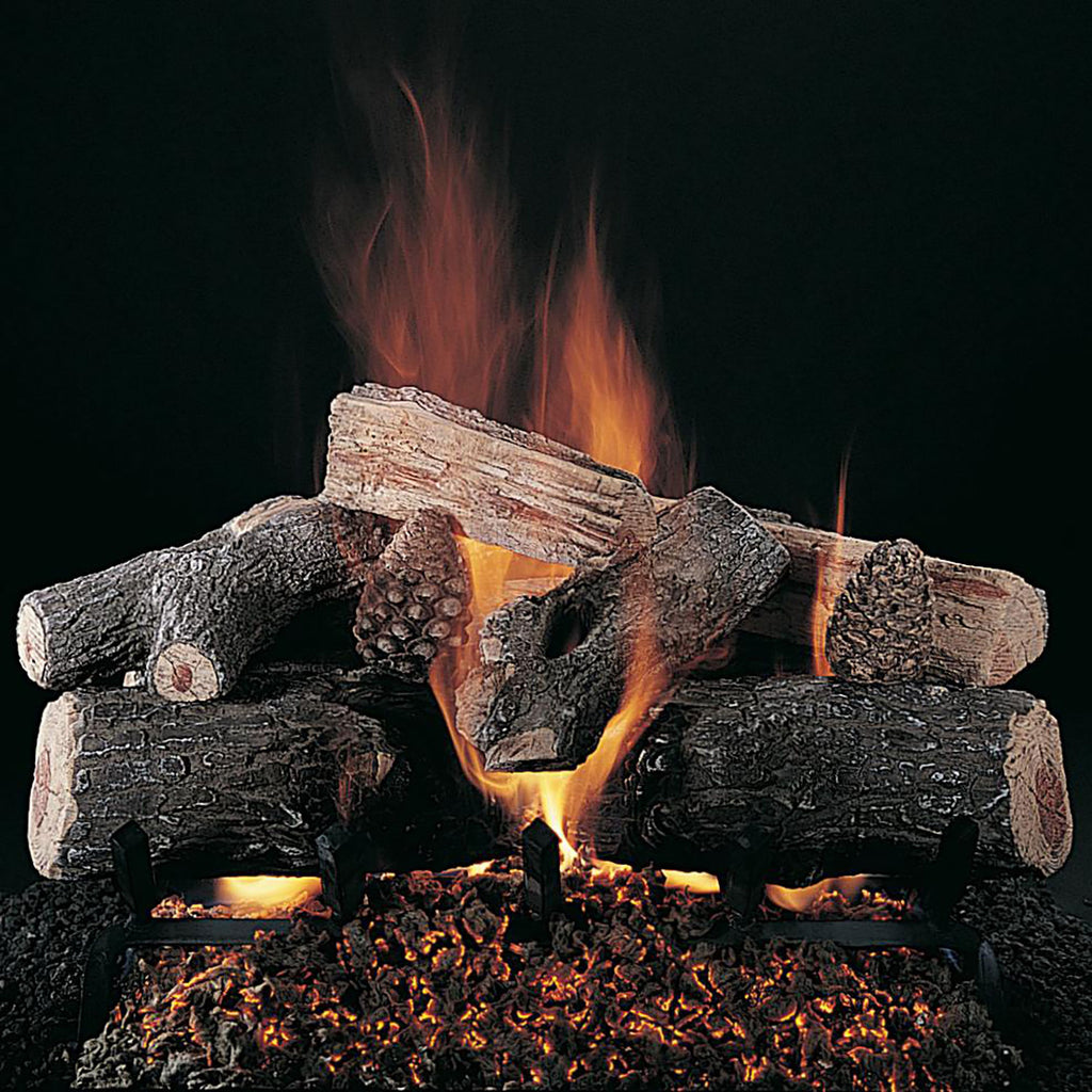 Fireplace log set with faux logs over an ember bed and visible flames
