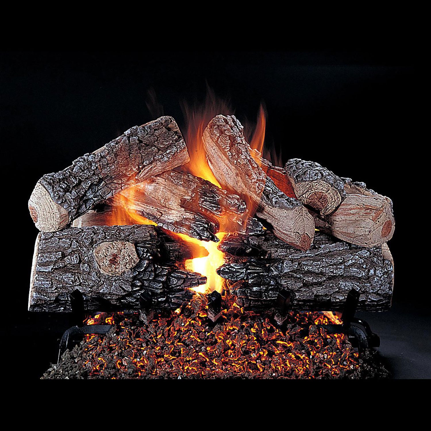 Fireplace log set with dark charred logs and glowing orange flames