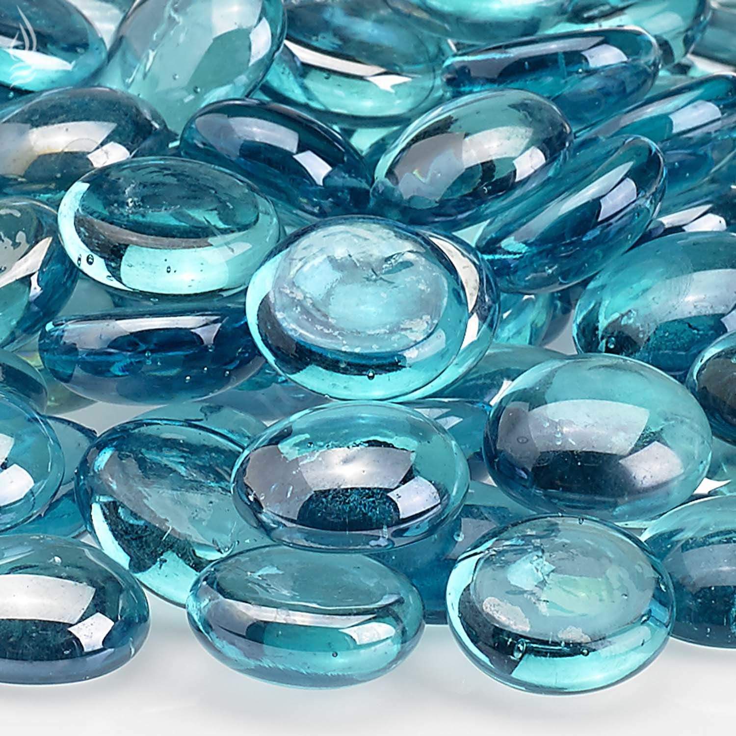 Close-up of aqua blue translucent glass fire beads with glossy highlights