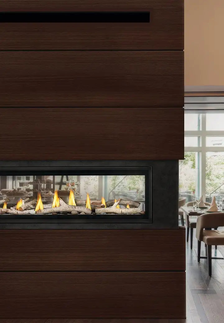 Modern see-through fireplace in a pillar in the middle of a modern dining space