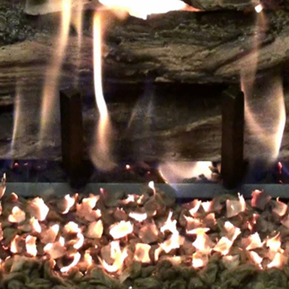 Glowing ember fireplace media with small flames and hot coals in a bed