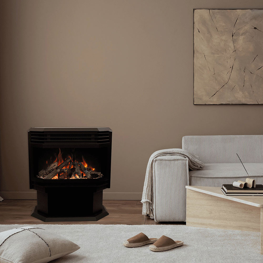 Freestanding electric fireplace with black body and front window, visible flame and log effect