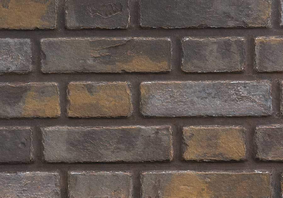 Decorative brick panel with dark gray and brown faux-stone blocks