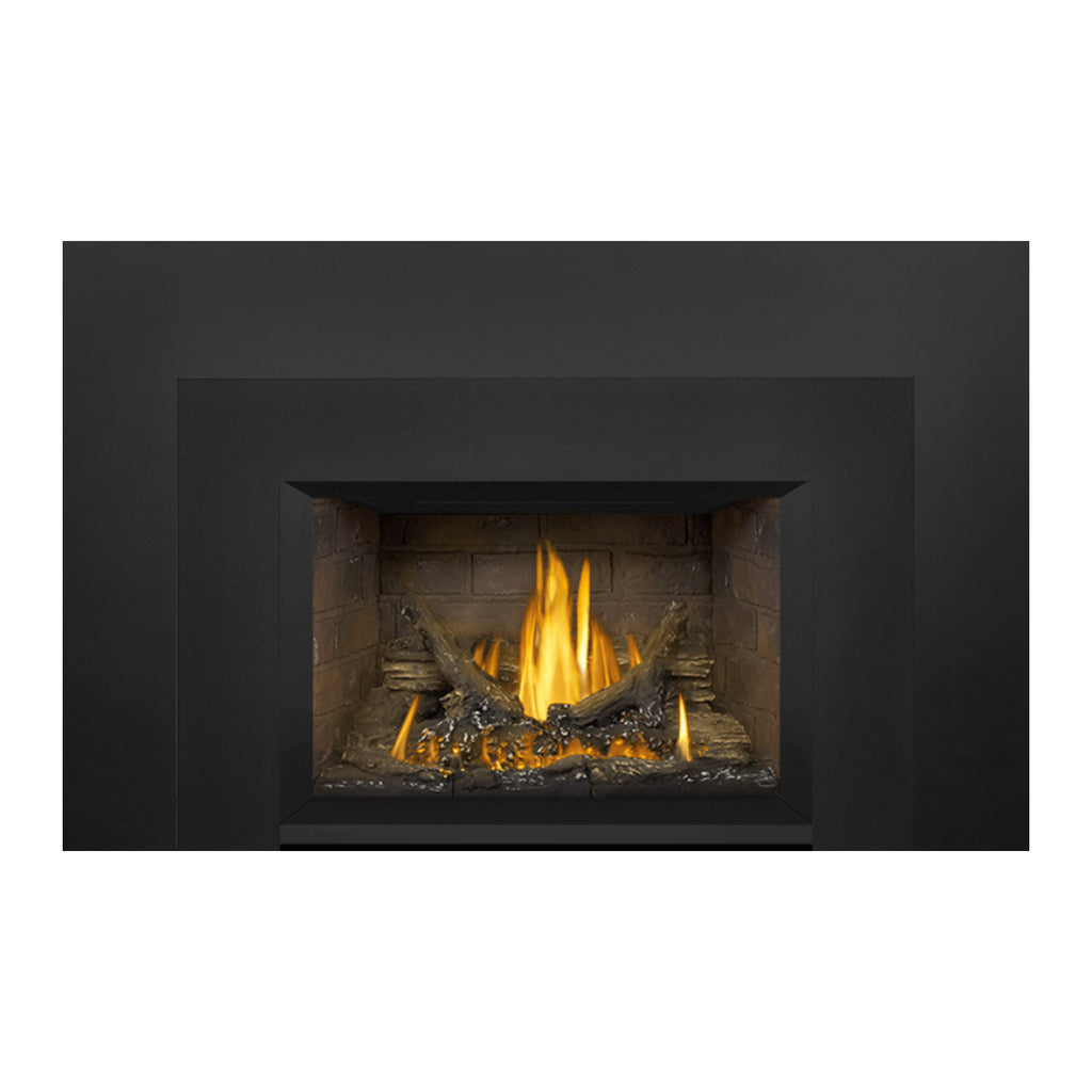 Gas fireplace insert with dark surround and lit flame in a brick firebox, front view