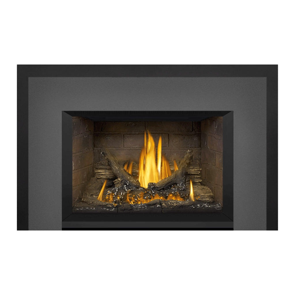Direct vent gas fireplace insert front with brick interior, tall yellow-orange flame and logs.