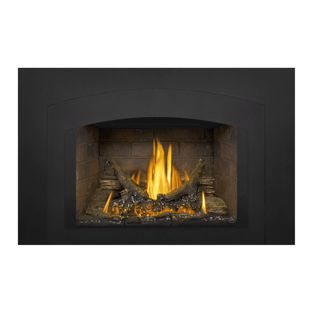 Direct vent gas fireplace insert with arched top opening and lit flames