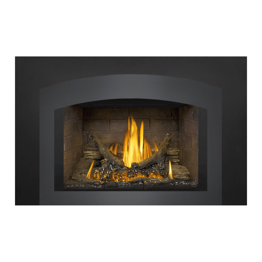 Direct vent gas fireplace insert with black surround, brick interior, burning log flame.