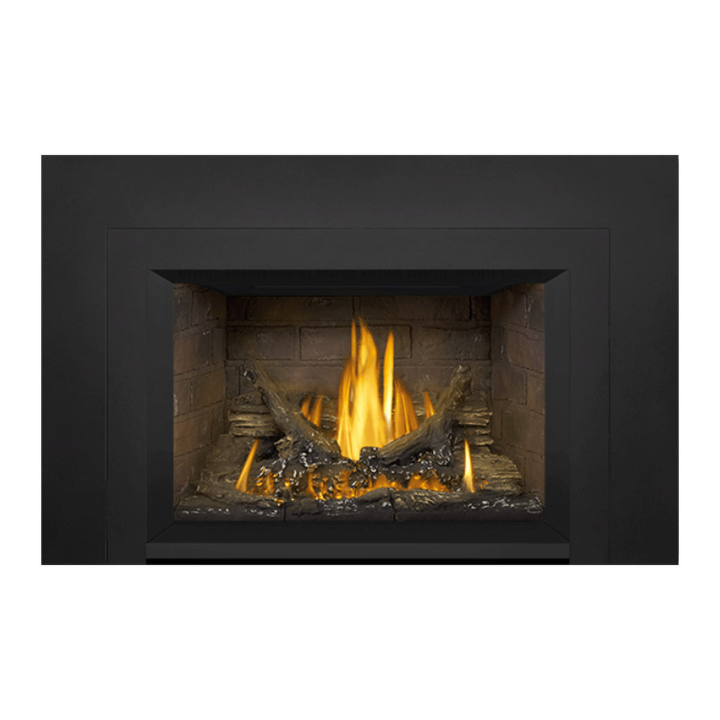 Gas fireplace insert with tan stone firebox and bright yellow flames in the front opening