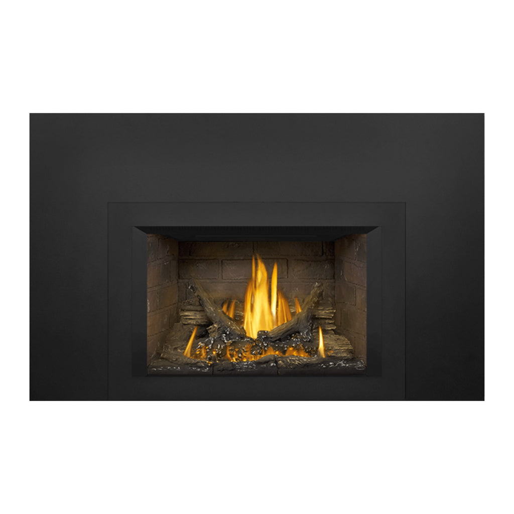 Gas fireplace insert showing inset stone firebox, glowing embers, and flames through glass