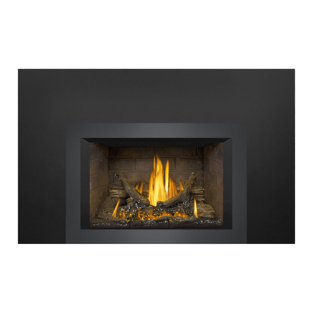 Direct vent gas fireplace insert with glowing log bed and orange flames