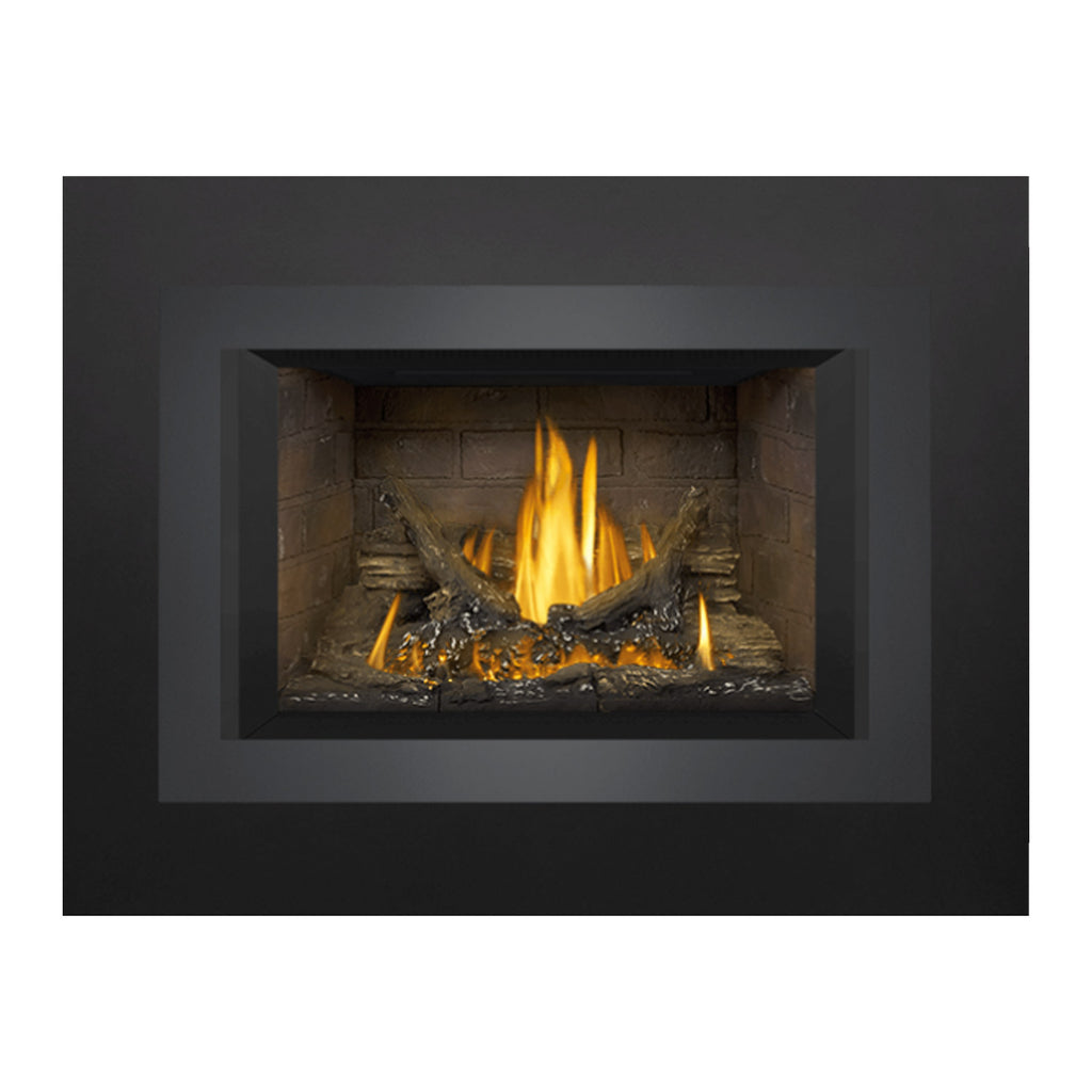 Direct vent gas fireplace insert with lit burner flame and stone back panel