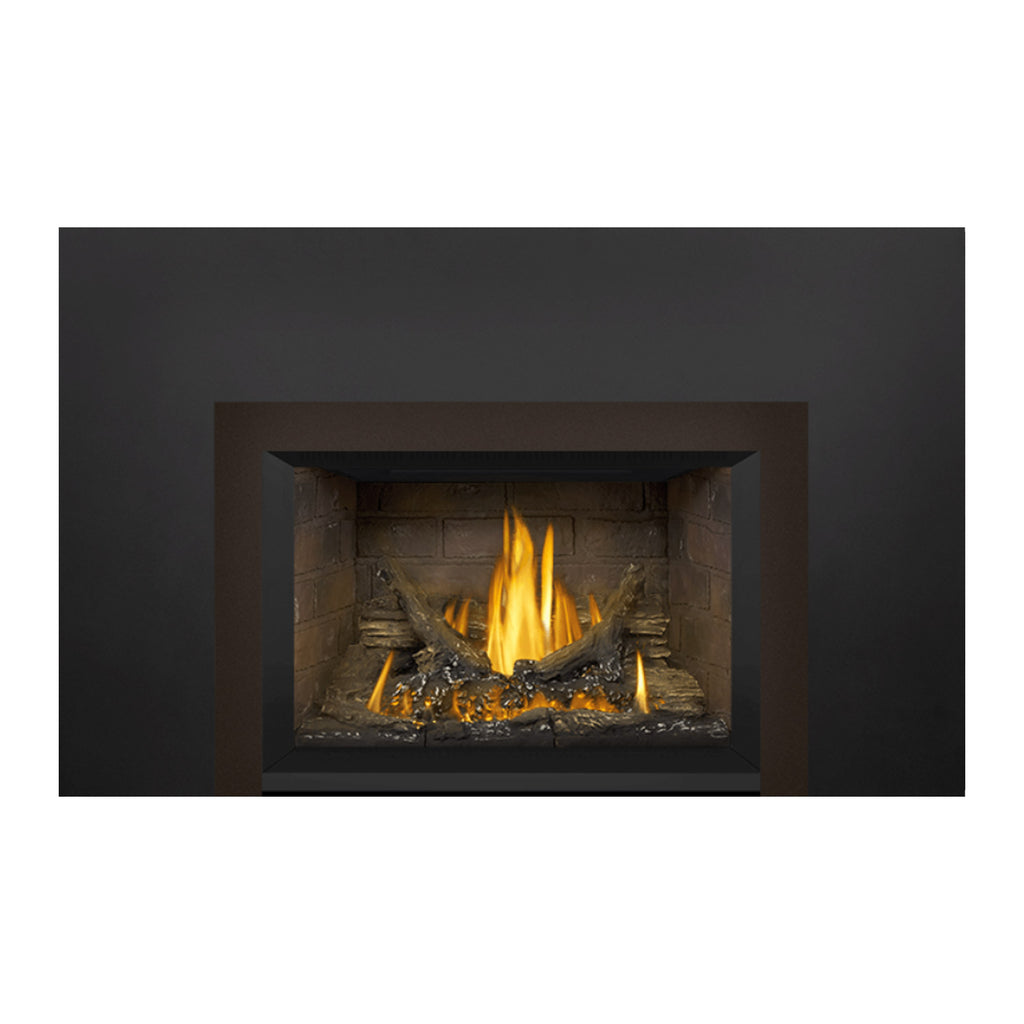 Gas fireplace insert with tan stone firebox and steady flames burning in the center