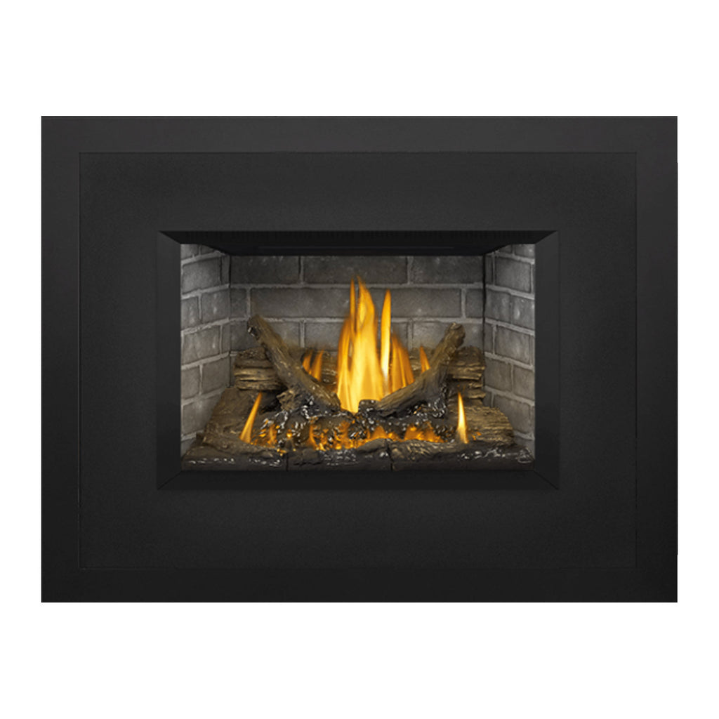 Dark gas fireplace insert with gray stone firebox and bright flames in the opening