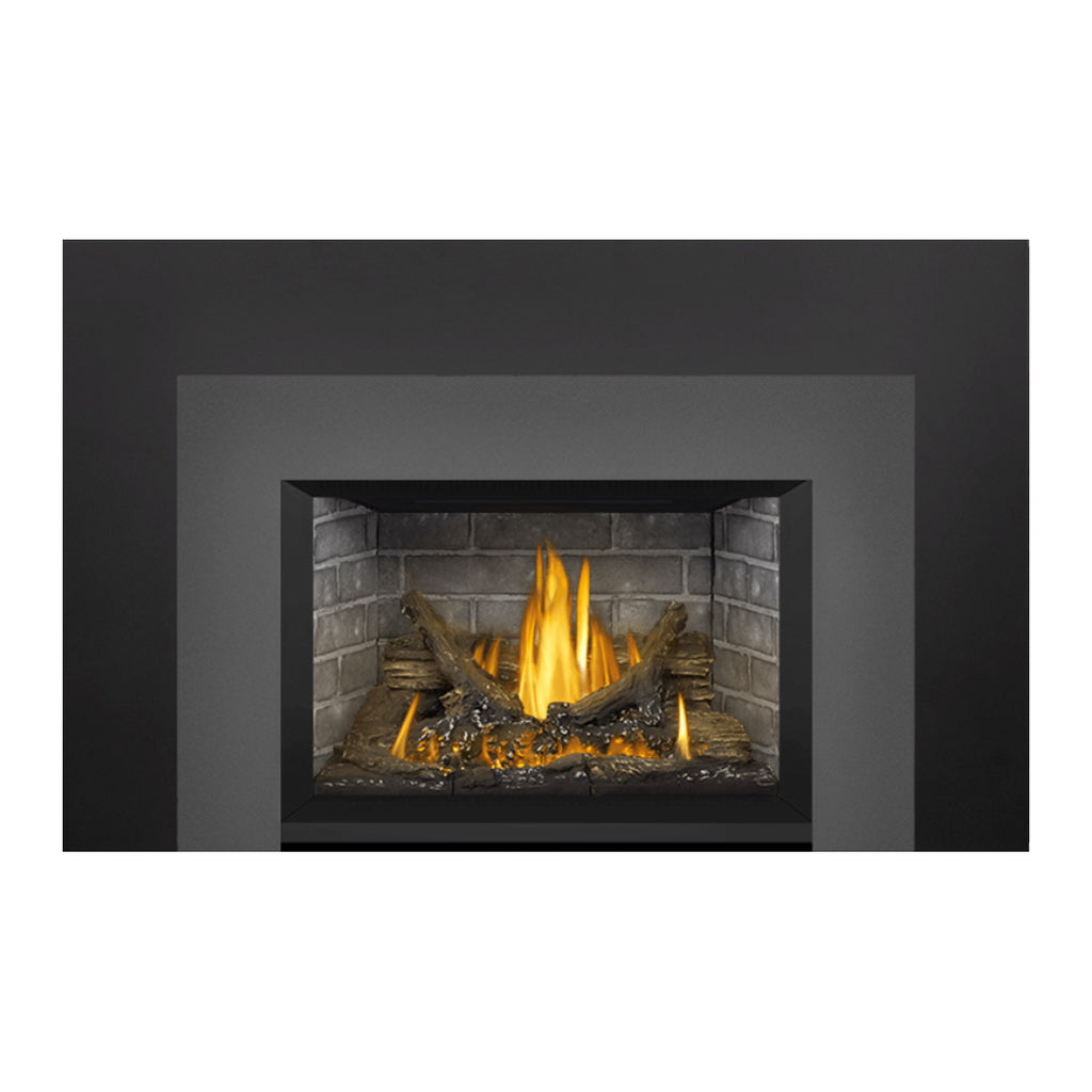 Gas fireplace insert with burning logs and ember bed in a dark surround
