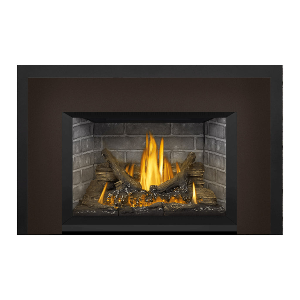 Gas fireplace insert with dark frame and flames burning in a stone firebox