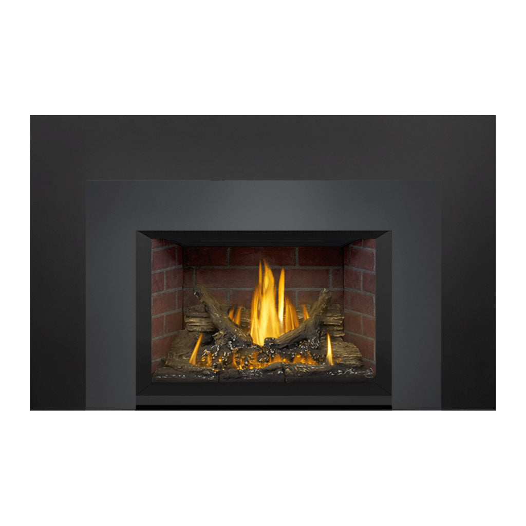 Direct vent gas fireplace insert showing burning flame, logs, and brick interior within black surround