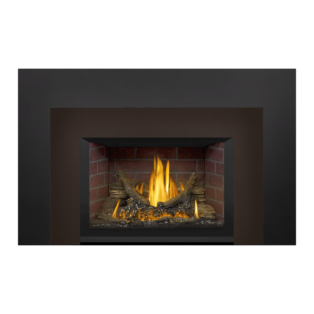 Direct vent gas fireplace insert with black frame around brick firebox, burning flame and logs