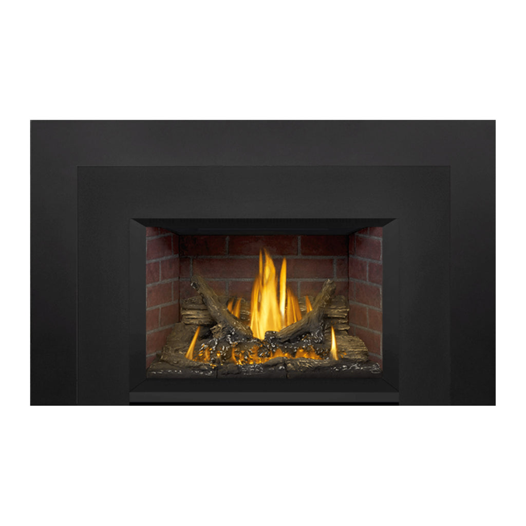 Direct vent gas fireplace insert featuring black surround, brick interior, and burning flame logs
