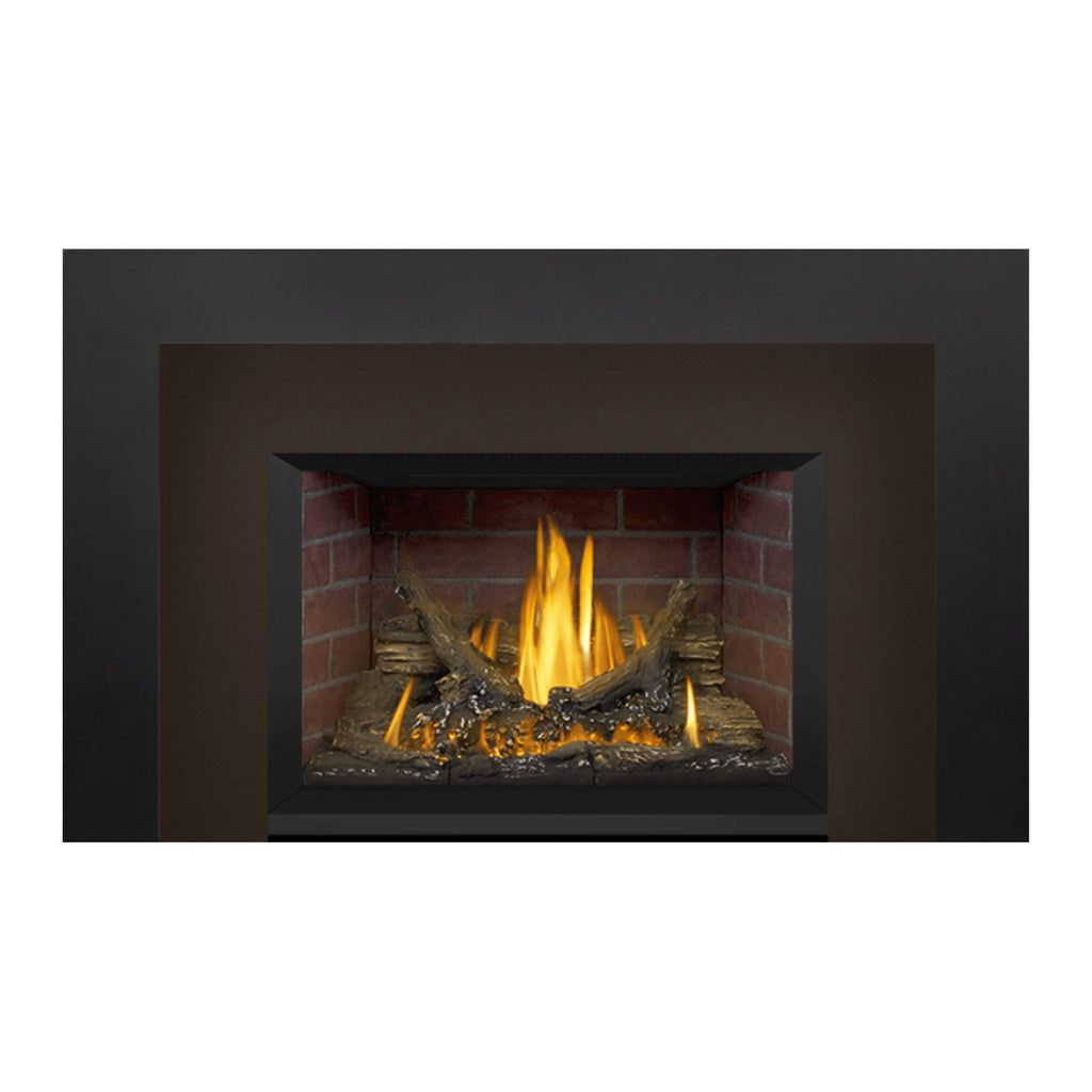 Gas fireplace insert with brick firebox, burning logs, and bright flames in view.