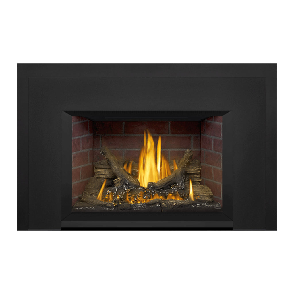 Direct vent gas fireplace insert with black surround and brick firebox, burning flame and logs