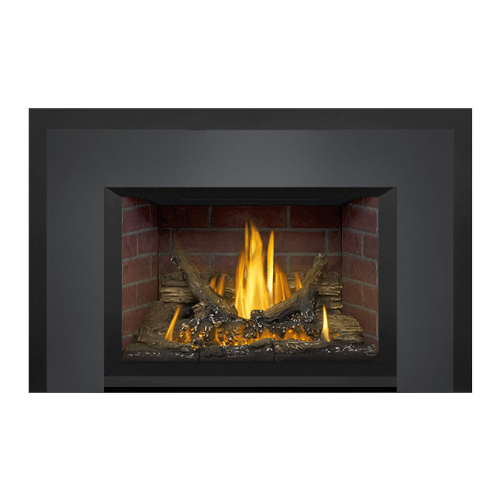 Gas fireplace insert with brick firebox and burning logs, wide front view.