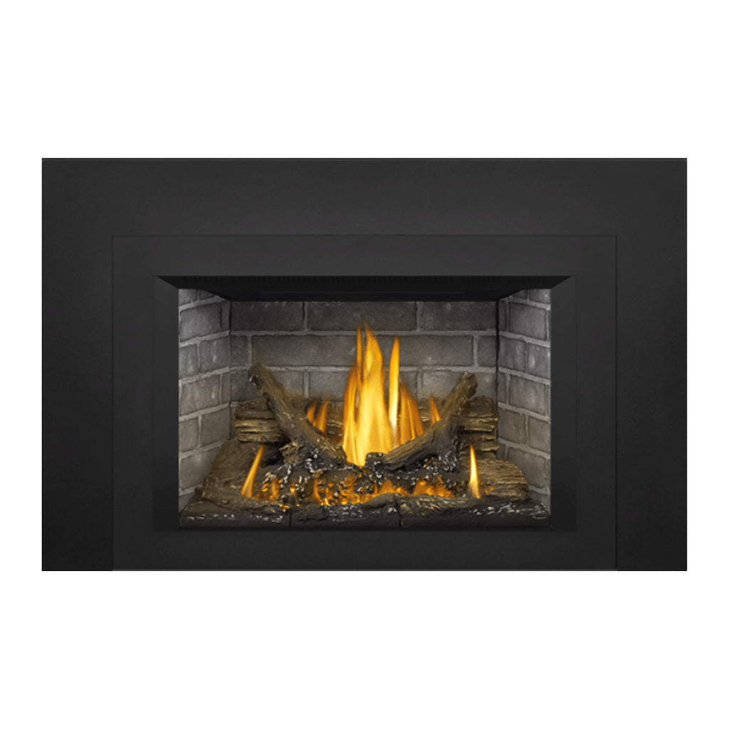 Gas direct vent fireplace insert with dark surround and visible flames over logs