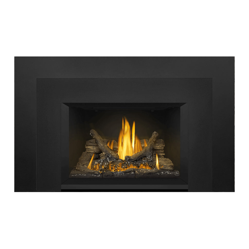 Direct vent gas fireplace insert with glowing logs and steady yellow flames behind black screen