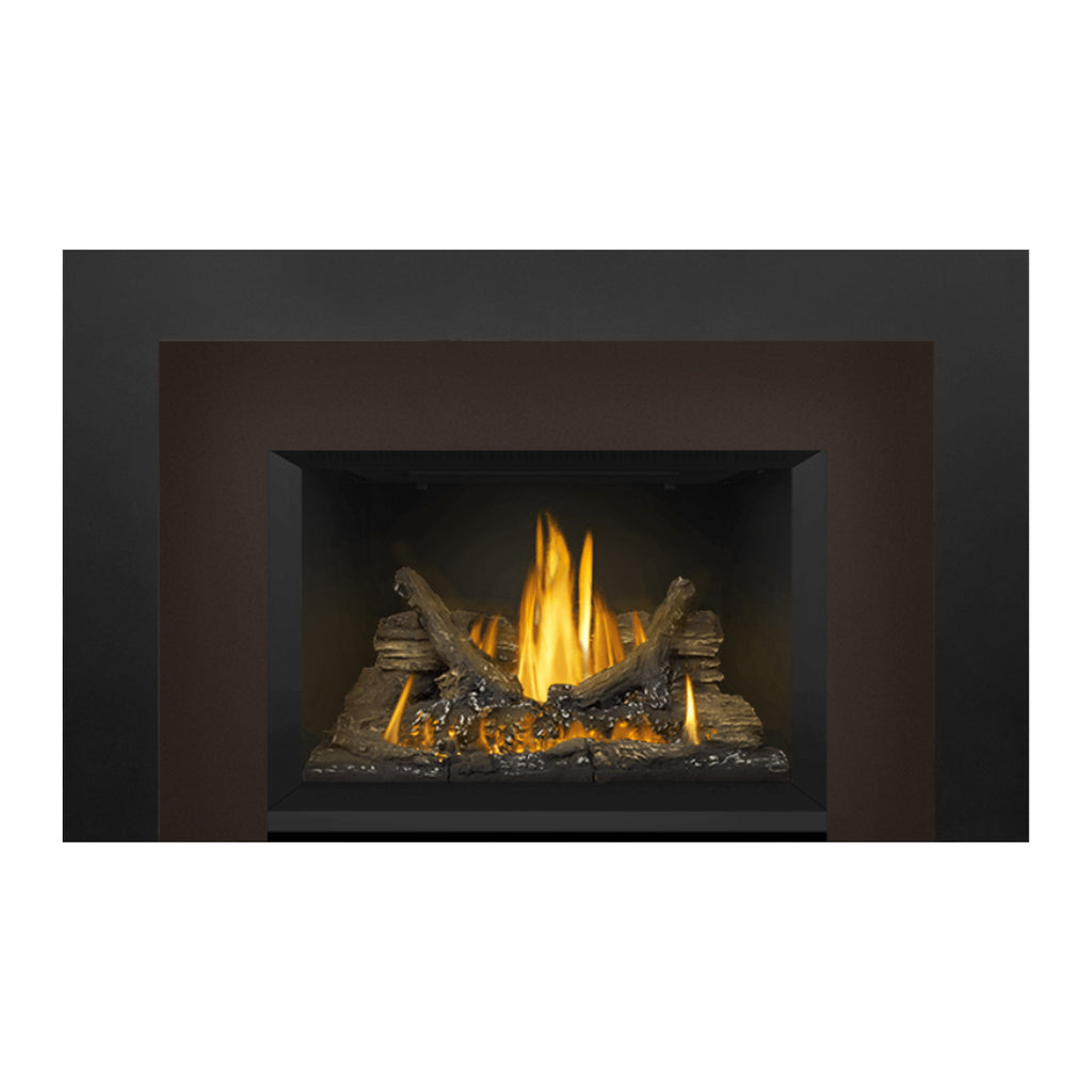 Direct vent gas fireplace insert with dark surround and glowing logs lit by yellow flames