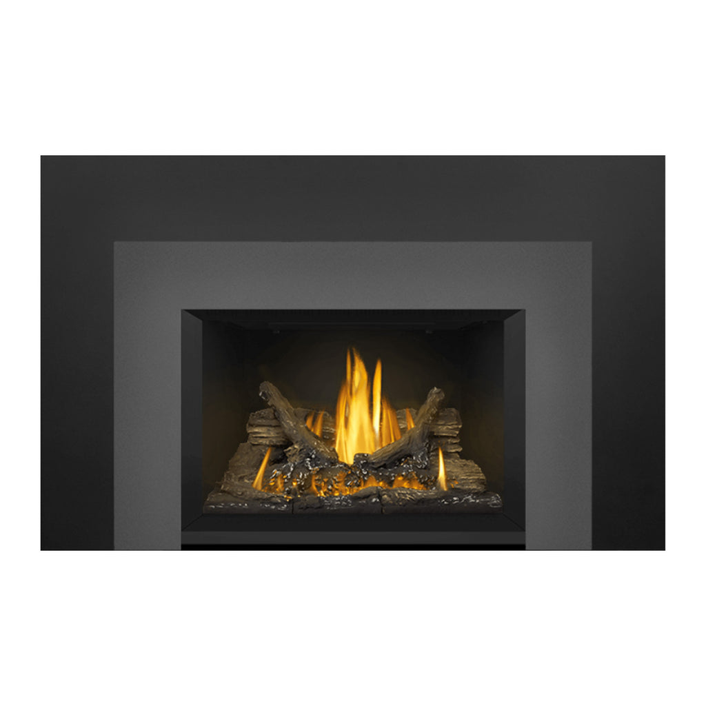 Gas fireplace insert with dark metal frame and glowing logs in the center firebox