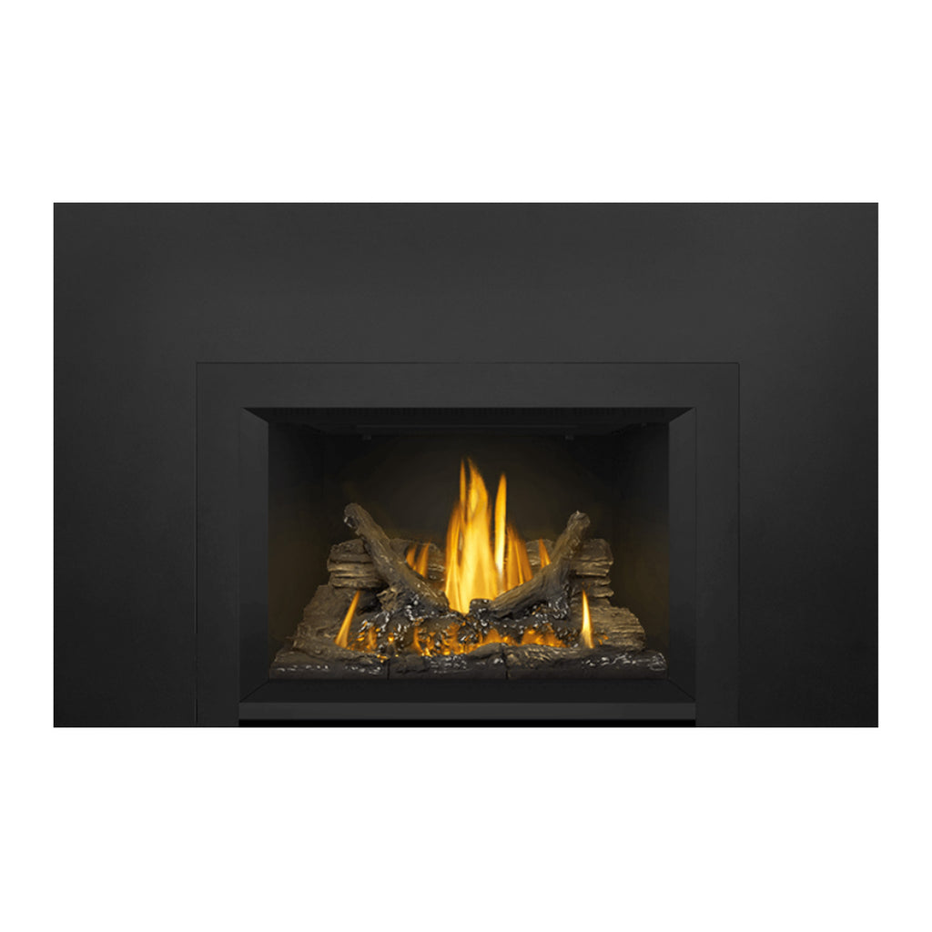 Direct vent gas fireplace insert with dark frame; tall flames rising from ember bed