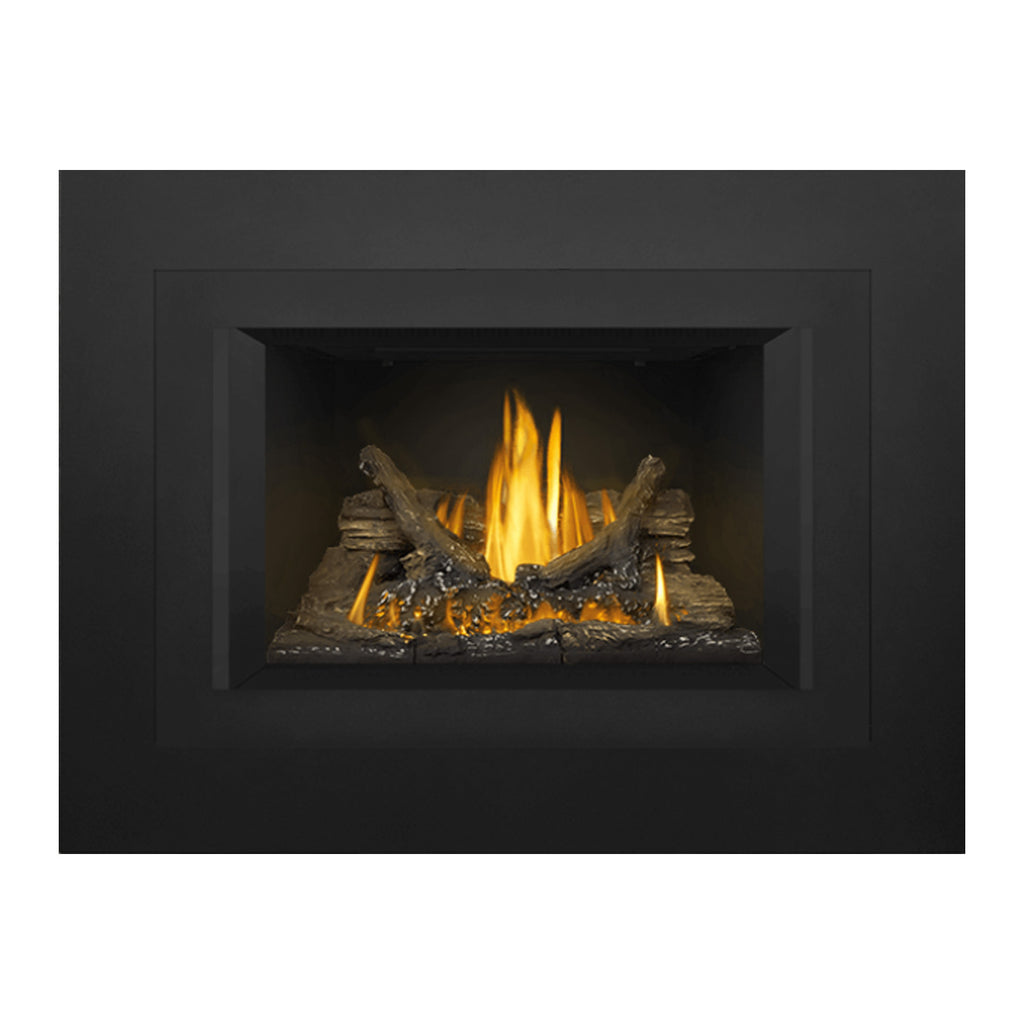 Gas fireplace insert with dark surround and central firebox showing logs and steady flames