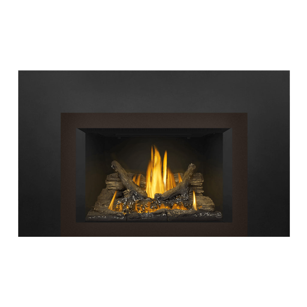 Direct vent gas fireplace insert with dark metal surround and glowing yellow flames