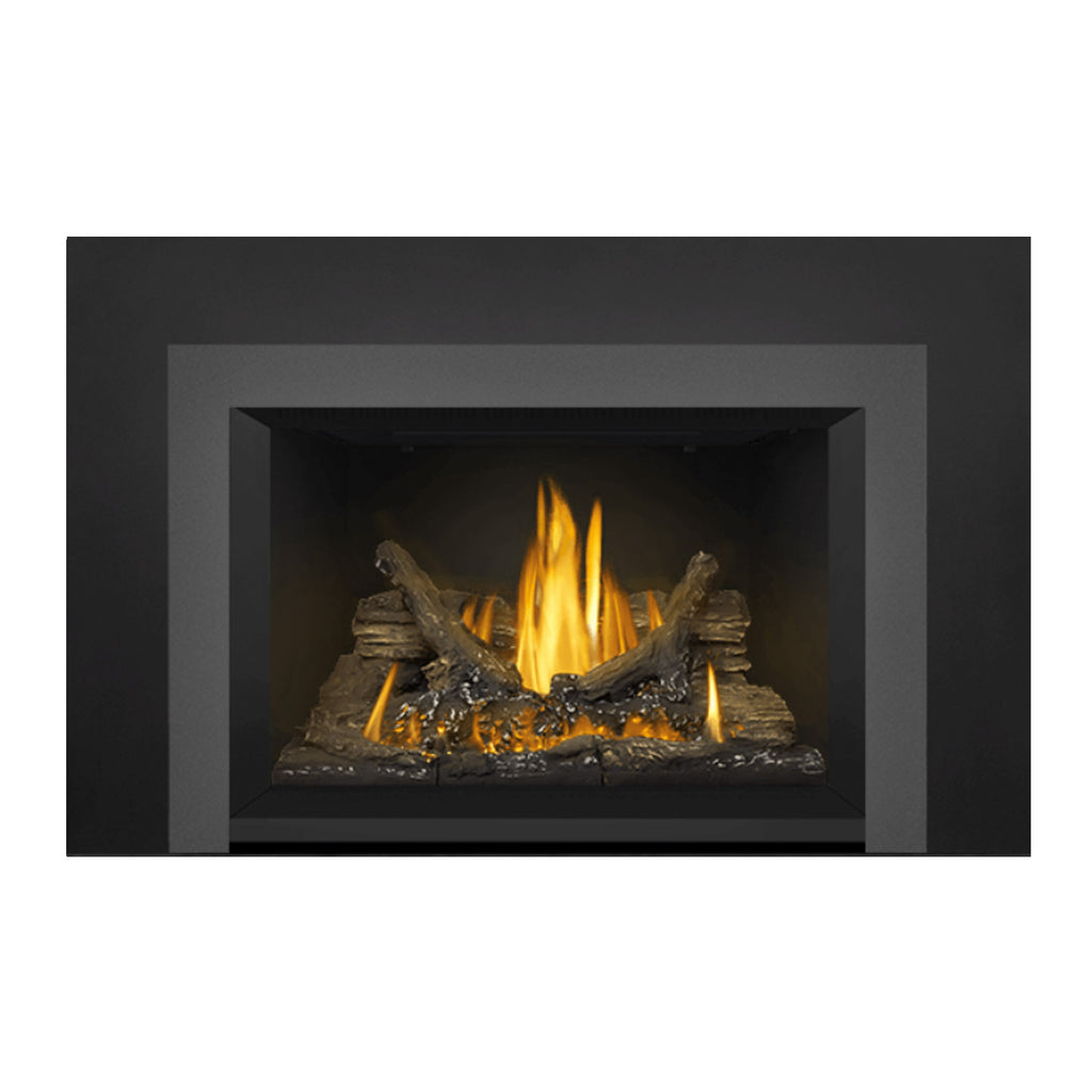 Gas fireplace insert with glowing flames, dark log set, and gray firebox trim