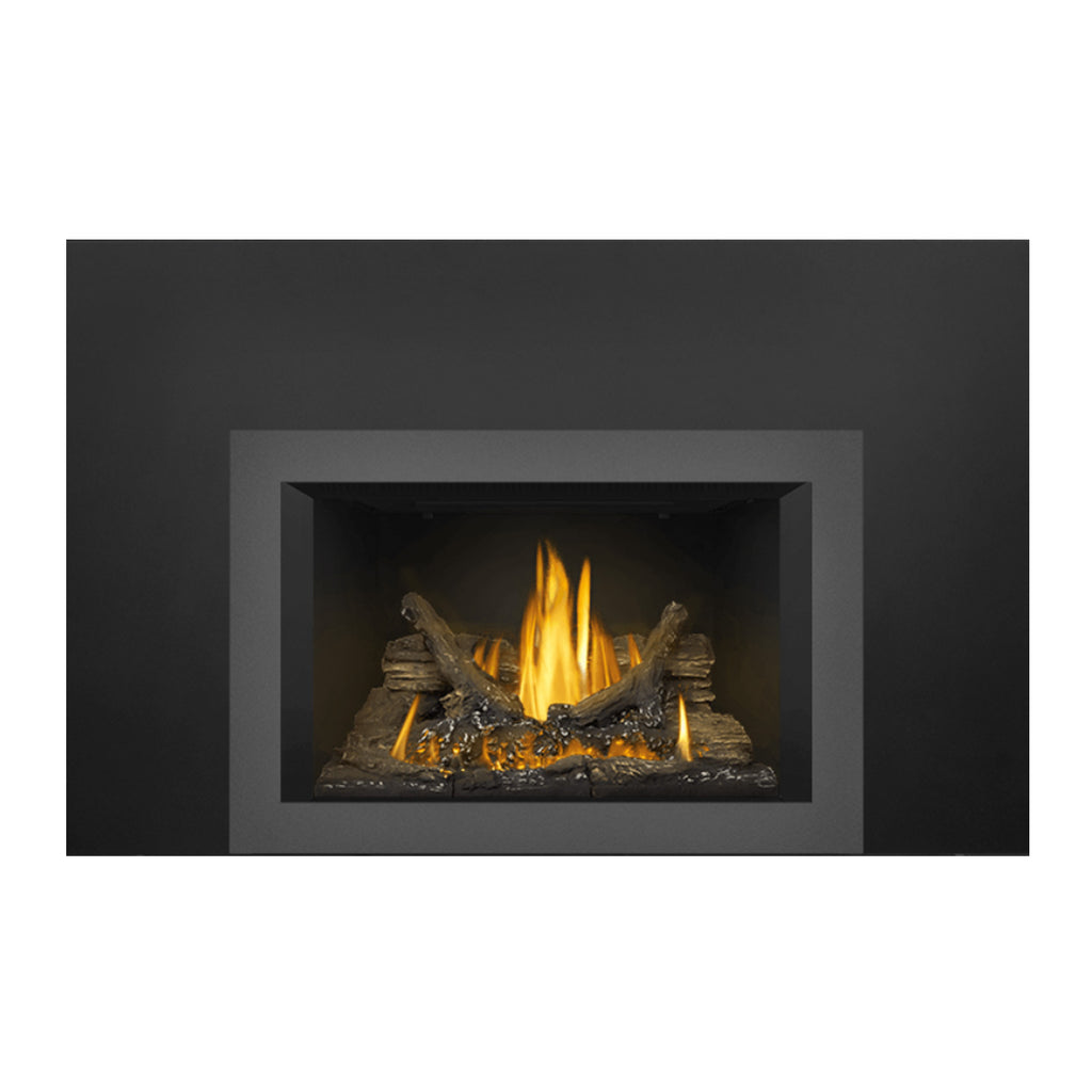 Direct vent gas fireplace insert with dark opening and flickering yellow flames on logs